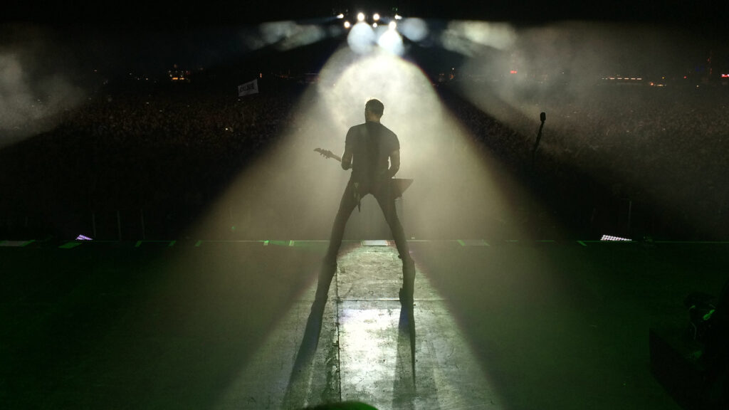 Metallica guitarist on stage from the back