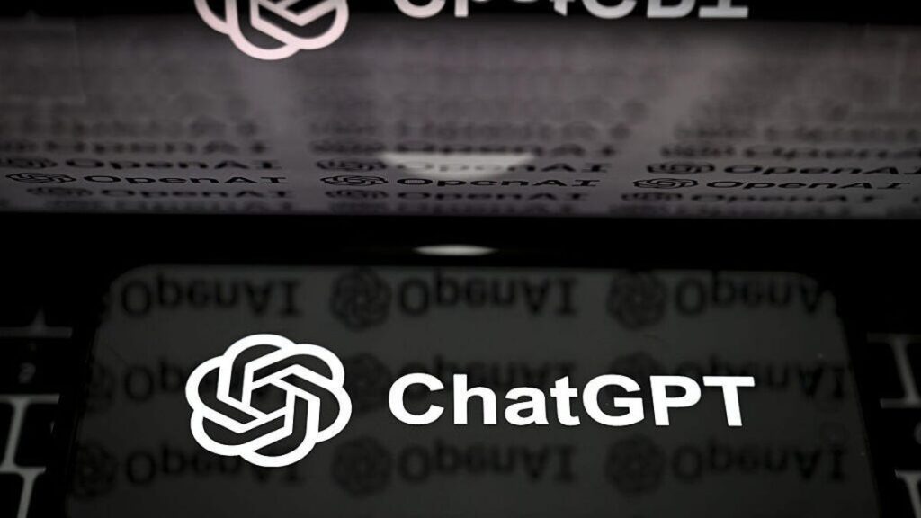 The ChatGPT logo on a phone and background.