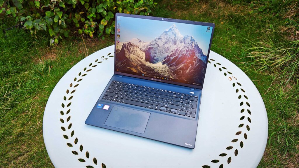 A dark blue Dynabook Tecra A60-M laptop on a garden table