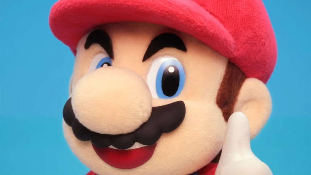 Mario stop motion animation; a felt Mario, in a red cap and moustache
