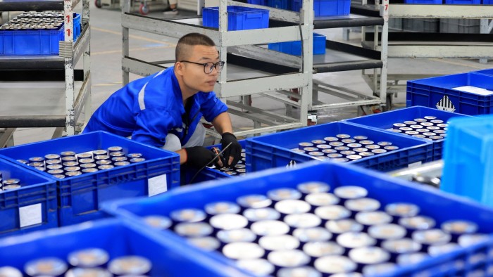 Batteries are crucial technology for the 21st century Workers produce new energy vehicle batteries on a production line in China