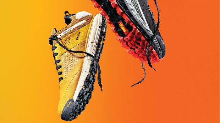 Paja buys in as Coats bounces back from April low Danner Trail 2650 men's runner in yellow and Altra Olympus 4 trail shoe in black and gray shown against an orange background.