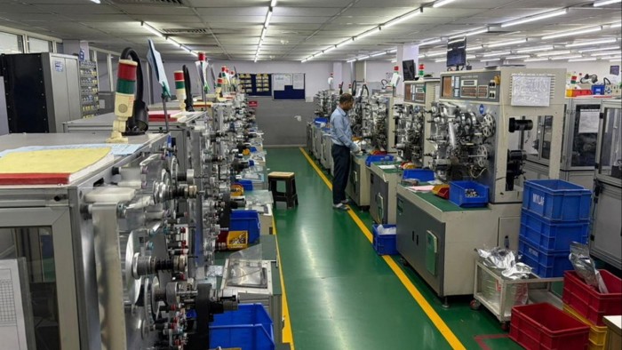 India aims to train vast pool of poorly skilled workers A worker operates machinery in a brightly lit room at Deki Electronics’ factory in Noida, India