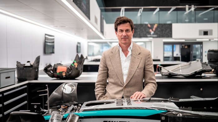 Mercedes F1 chief Toto Wolff to sell stake at $6bn valuation Toto Wolff stands behind a Mercedes-AMG PETRONAS F1 car part inside the team's headquarters workshop.