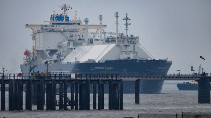 Surging gas prices worsen affordability crisis for Americans The LNG tanker Energy Glory approaches the Grain LNG importation terminal, with part of the dock and water visible in the foreground.